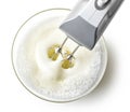 Beating egg whites cream with mixer in the bowl Royalty Free Stock Photo