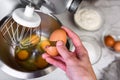 Beating eggs with an electric mixer for sponge biscuit cake dough. Royalty Free Stock Photo