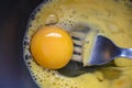 Beating eggs with a fork in a bowl. Cooking preparation concept. Royalty Free Stock Photo