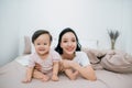 Beatuful mother playing with daughter. Little girl have fun at home Royalty Free Stock Photo