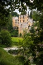 Beaufort Castle in Luxembourg through trees Royalty Free Stock Photo