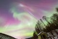 Beauitful aurora over the night sky, wooden house Royalty Free Stock Photo