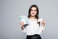 Beauitful woman holding some Euro currency notes and white blank in other hands for copy space isolated over white background