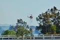 A helicopter andBeaumont and Banning , California fire fighters responding to a grass fire on a hot day