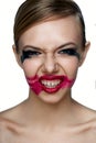 Beaury evil Girl with scary Smile. Smeared Mascara and Lipstick Royalty Free Stock Photo