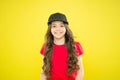 Beauteous Maximus. small girl with long hair. cool girl with long curly hair. kid fashion. happy girl in trendy hipster Royalty Free Stock Photo