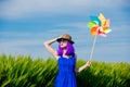 girl with pinwheel at wheat field Royalty Free Stock Photo