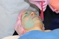 Beautician applies Alginate Peel-Off Powder Mask for the face