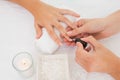 Beautician applying nail varnish to female client's nails Royalty Free Stock Photo