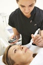 Beautician Carrying Out Ultrasound Skin Rejuvenation Treatment Royalty Free Stock Photo