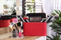 Beautician case with professional makeup products and tools on dressing table Royalty Free Stock Photo