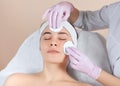 Beautician cleanses the skin before medical procedures. Cosmetology treatment in the beauty salon