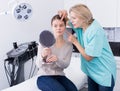 Beautician discussing treatment with girl