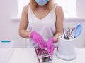 Beautician disinfect professional tools. Royalty Free Stock Photo