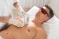 Beautician Giving Laser Epilation Treatment To Man Royalty Free Stock Photo