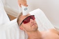 Beautician Giving Laser Epilation Treatment Royalty Free Stock Photo