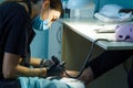 Beautician grinds the nail bar for a pedicure in the beauty salon