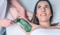 Beautician hands doing depilation in woman armpit