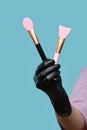 Beautician holds set of spatulas