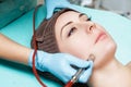 Beautician makes mechanical cleaning of face. Procedure of Microdermabrasion, diamond grinding. Royalty Free Stock Photo