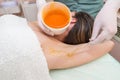 A beautician makes a sugar paste depilation under the armpits in a beauty salon Royalty Free Stock Photo