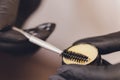 Beautician- makeup artist applies paint henna on previously plucked, design, trimmed eyebrows in a beauty salon in the Royalty Free Stock Photo