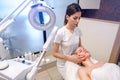 Beautician massaging woman& x27;s face at beauty clinic. Royalty Free Stock Photo