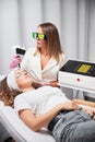 Treatment of telangiectasias by yellow laser in beauty clinic. Royalty Free Stock Photo