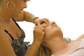 Beautician Tweezing Eye Brows