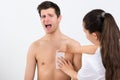 Beautician Waxing Man's Chest In Beauty Center Royalty Free Stock Photo