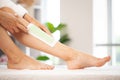 Beautician waxing woman legs in a spa salon Royalty Free Stock Photo