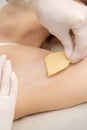 Beautician waxing young female armpit Royalty Free Stock Photo