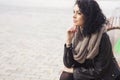 Beautifil brunette caucasian woman in leather jacket and scarf w