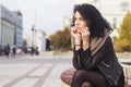 Beautifil brunette caucasian woman in leather jacket and scarf w