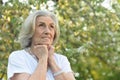 Beautifil elderly woman posing in autumn park Royalty Free Stock Photo