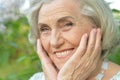 Beautifil elderly woman posing in autumn park Royalty Free Stock Photo