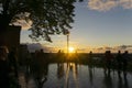 Beautifil orange sunset on old town viewpoint with rain refflection watter on ground Royalty Free Stock Photo