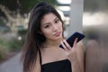 Beautifu Asian woman holding phone