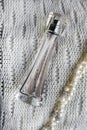 The beautifu autumn perfume bottle on white background and pearls beads