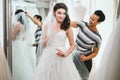 Beautifu bride choosing wedding dress in a wedding salon Royalty Free Stock Photo