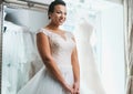 Beautifu bride choosing wedding dress in a wedding salon Royalty Free Stock Photo