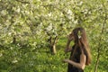 Beautifu girl in blossoming flowered spring garden Royalty Free Stock Photo