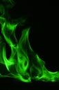 Beautifu green fire flames on a black background. Royalty Free Stock Photo