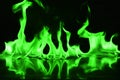 Beautifu green fire flames on a black background. Royalty Free Stock Photo