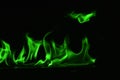 Beautifu green fire flames on a black background. Royalty Free Stock Photo