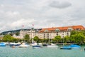 Beautifu historicl buildings with the opera house on the hills and on the lakeshore, and the yachts on the Lake of Zurich, Royalty Free Stock Photo