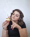 Beautiful full pretty girl expression enjoy sweet food baking cake surprise emotions delicious Royalty Free Stock Photo