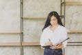 Beautifu young Asian Business woman holding files. Royalty Free Stock Photo