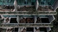 A beautiful abandoned hotel on the mountain. Plants on balconies. Royalty Free Stock Photo