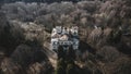 Beautiful abandoned manor at sunset. Tall trees. Beautiful sunlight. Old abandoned building.